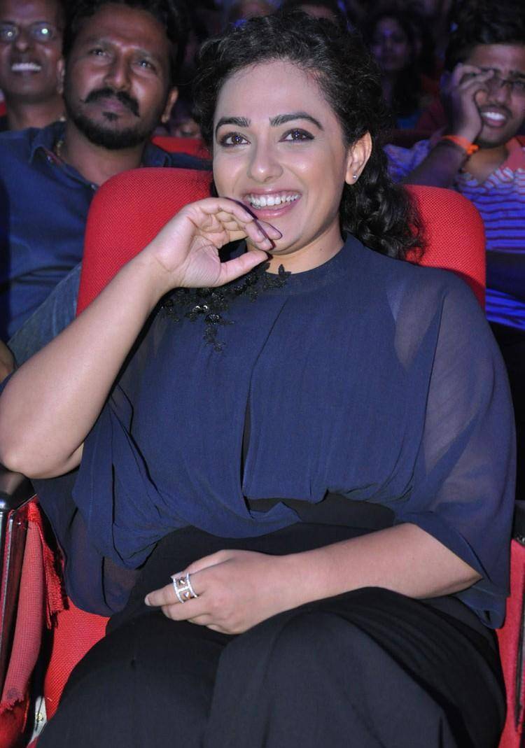 Actress Nithya Menon Stills At Movie Audio Launch In Blue Dress