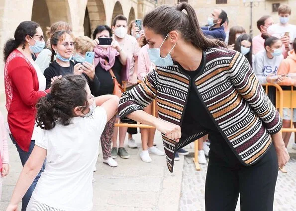 Queen Letizia wore a multicolor tweed jacket by Uterque, and Uterque high heel fabric shoes. gold earrings Boss sweater