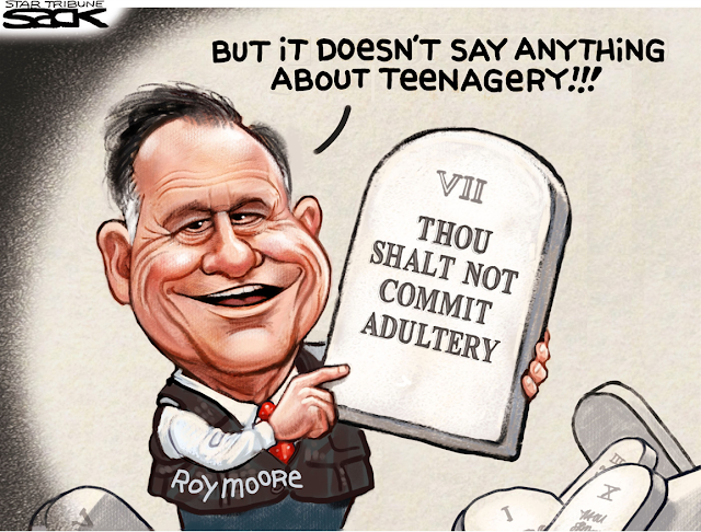 Roy Moore points at stone tablet that says, 