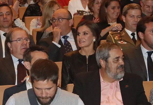 Queen Letizia wore a leather peplum jacket by EmporIio Armani and a black crepe wide-leg trousers by Carolina Herrera