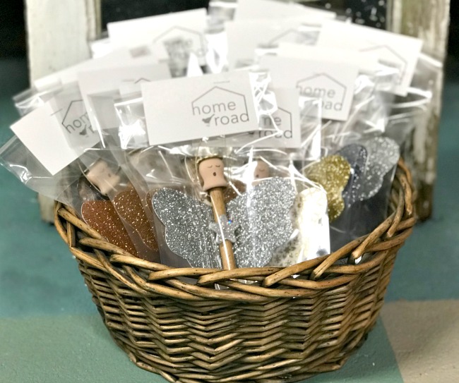 basket of glittered angel ornaments in packages