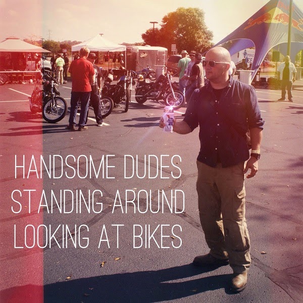 Handsome Dudes Standing Around Looking At Bikes