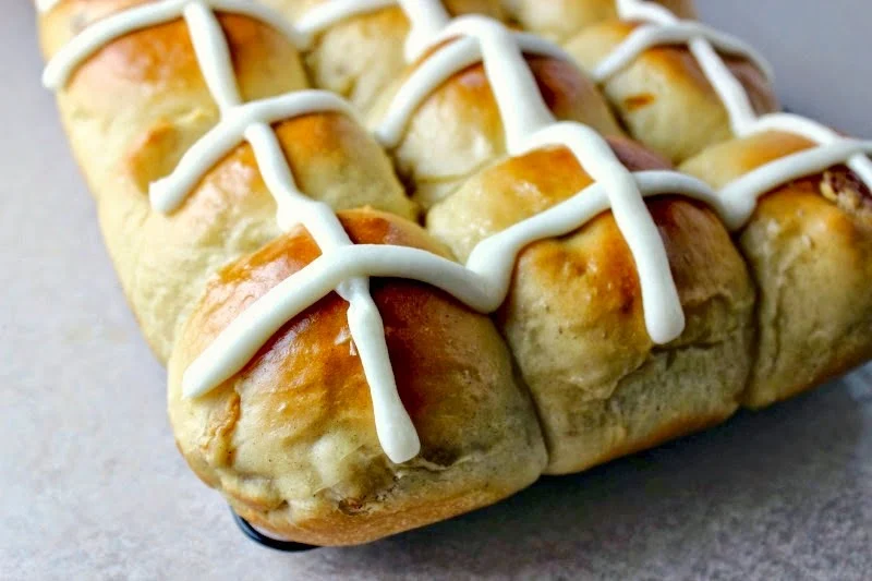 Easy Hot Cross Buns by Renee's Kitchen Adventures on a tray frosted with an X