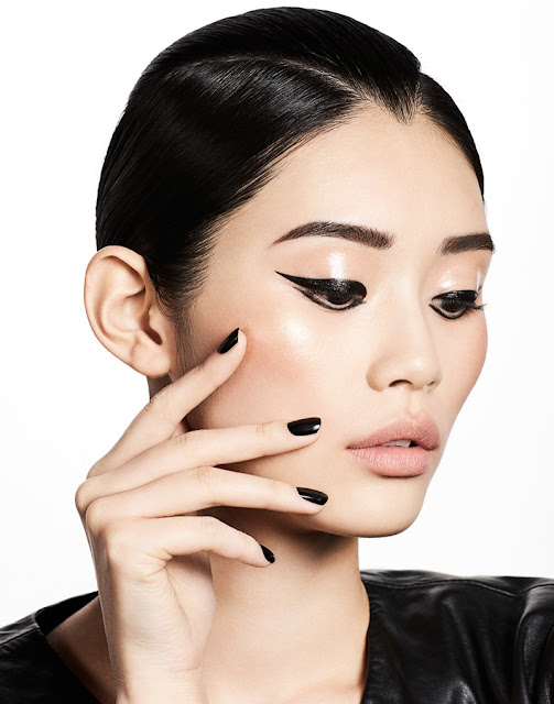 Ming Xi wears graphic eyeliner with a black manicure