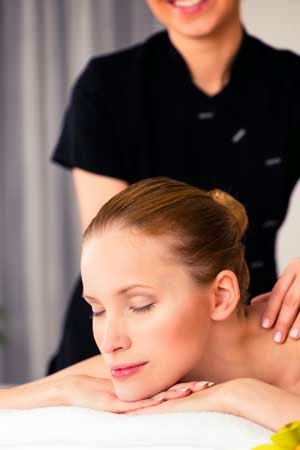 New mother receiving a Post Natal Massage for stress relief and pain