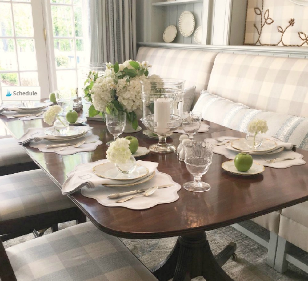 Blue and white checks on banquette and vintage table in breakfast room of Southeastern Designer Showhouse 2017