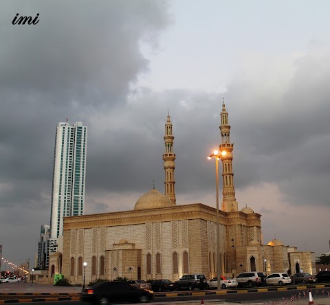 Dark Clouds, Mosque, Sky Scraper and Cars... Beauty...