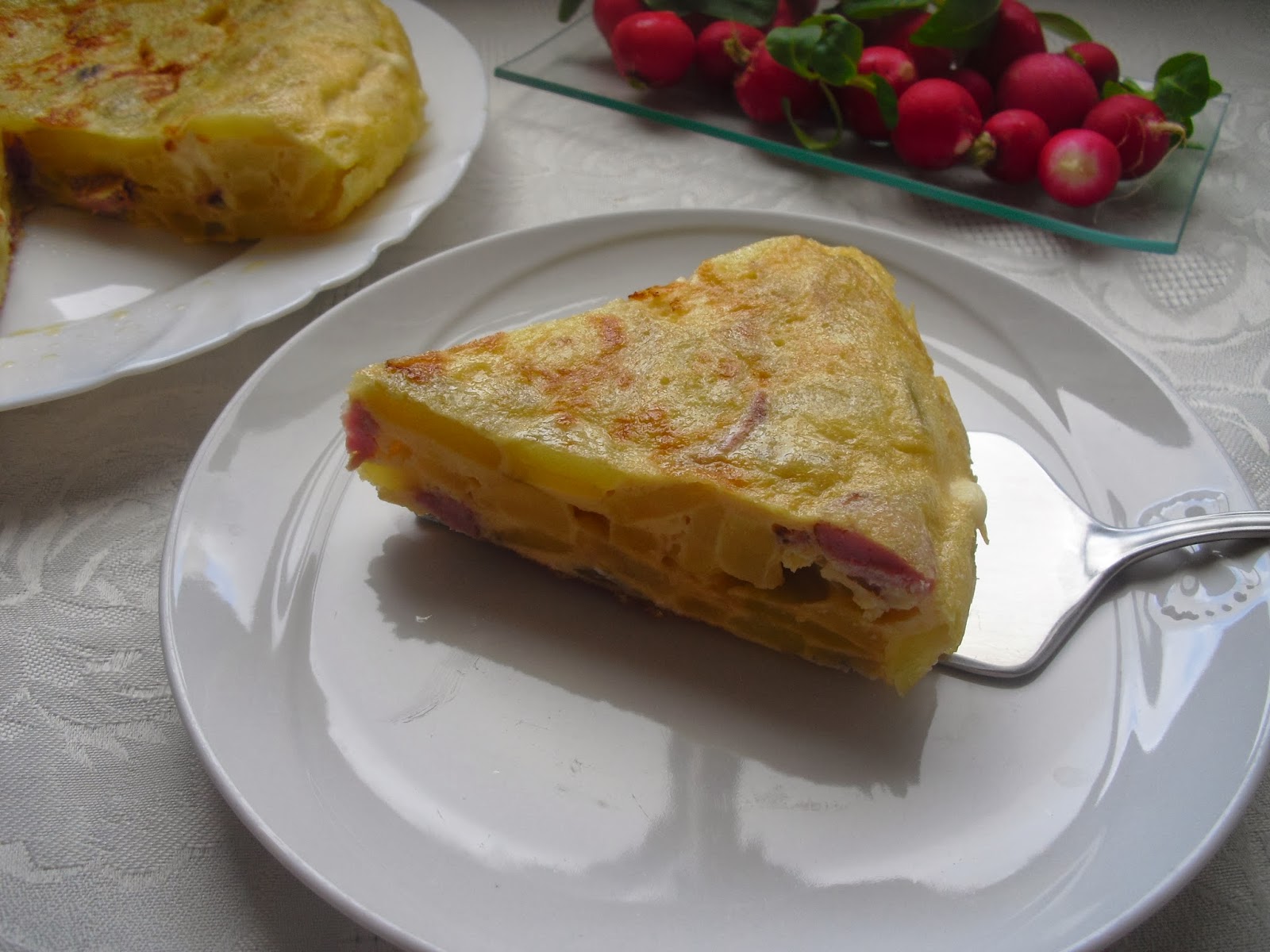 Tortilla de patatas con salchichas y quesitos y Premio Con sabor a huerto