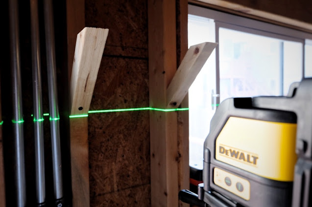 using laser level to install small shelf