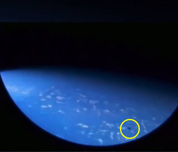 Three UFOs actual fly past the ISS and the astronaut aboard the ISS looks like he or she are secretly filming it.