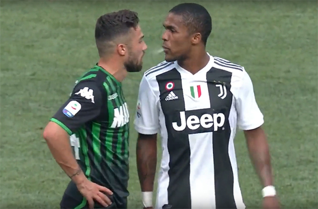Juventus player Douglas Costa spits in the mouth of Sassuolo player Federico Di Francesco