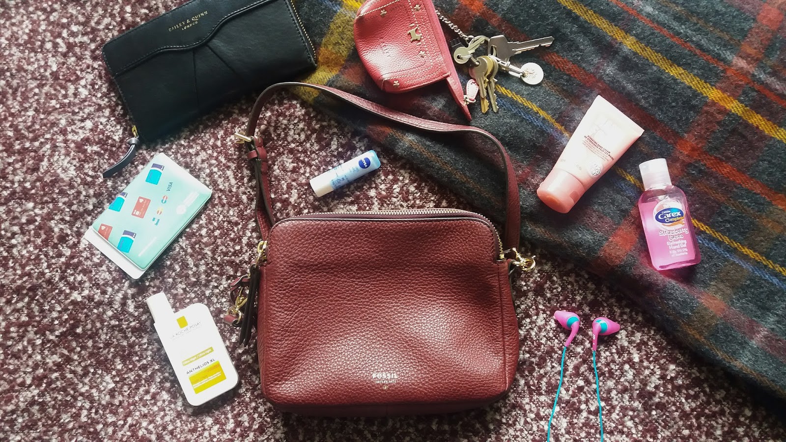 fossil carry on bag