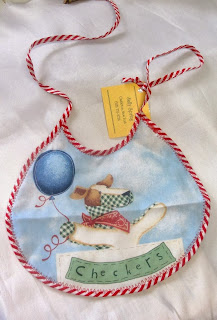 Shop for handmade baby shower gifts like this Checkers baby bib which is hand-sewn by Sally Spring and is available at handamdecatalog.com for only $3.00