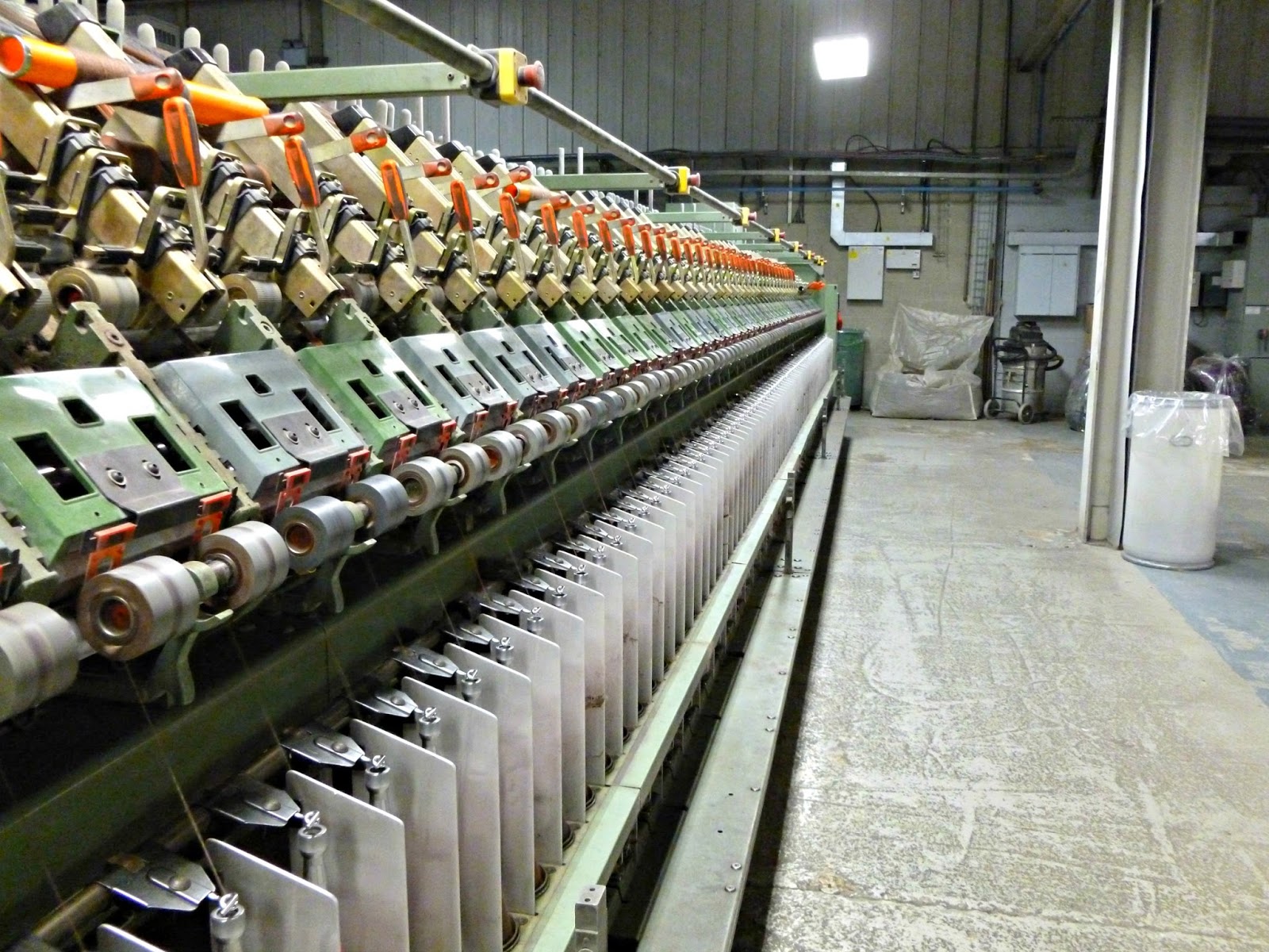 and here it is as yarn on the spindle at the bottom. It's really quite