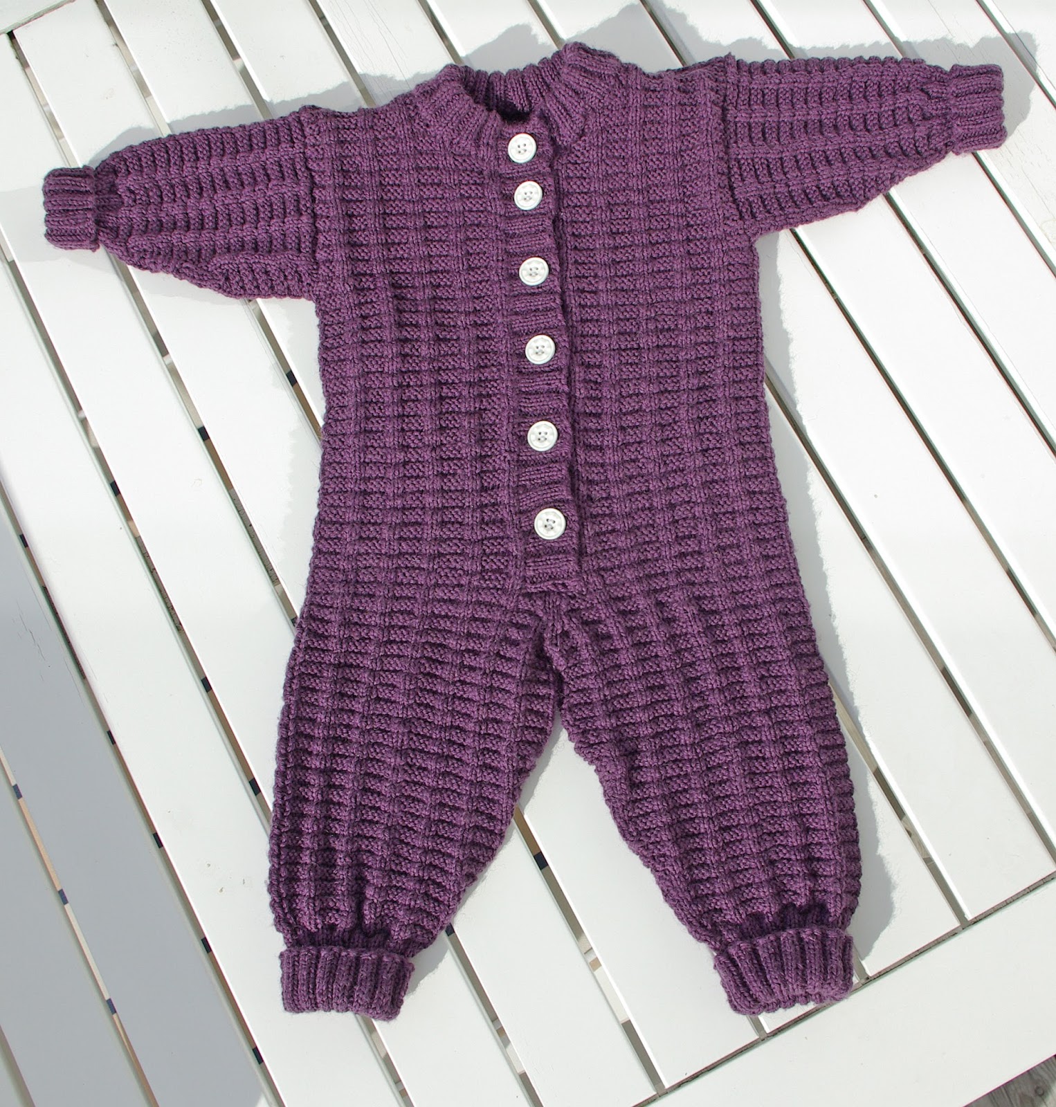 Baby In Cute Knitted Outfit