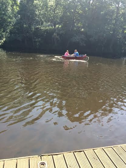 rowing boats on river at Morpeth Park, Northumberland 