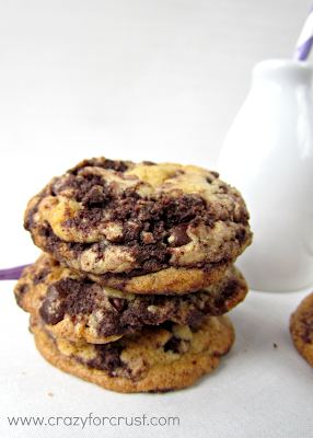 Stack of cake ball chocolate chunk cookies on a white napkin
