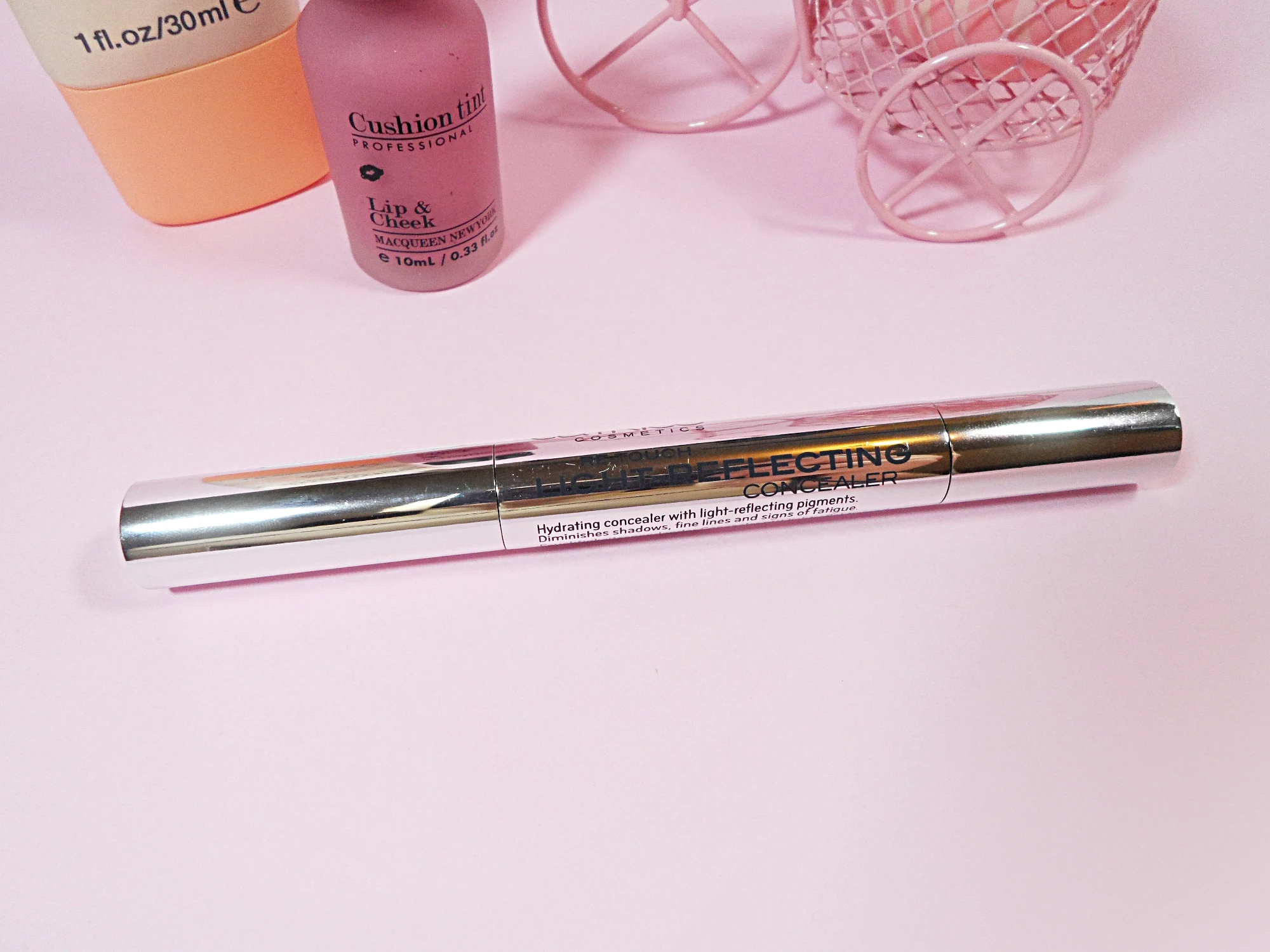 close-up of catrice makeup concealer on the pink studio's background