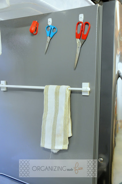 Use hooks on the side of an upright freezer to hang scissors :: OganizingMadeFun.com