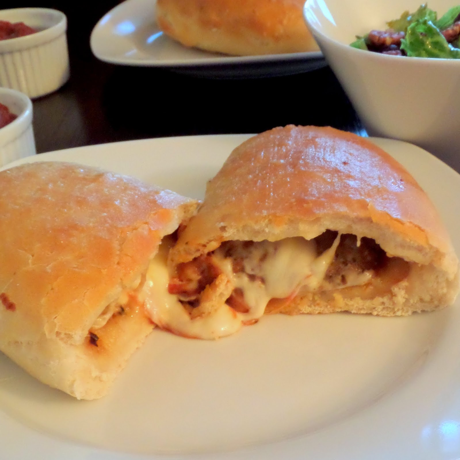 Meatball Calzones:  Hot gooey cheese and meatballs folded inside a soft and chewy pizza crust. 