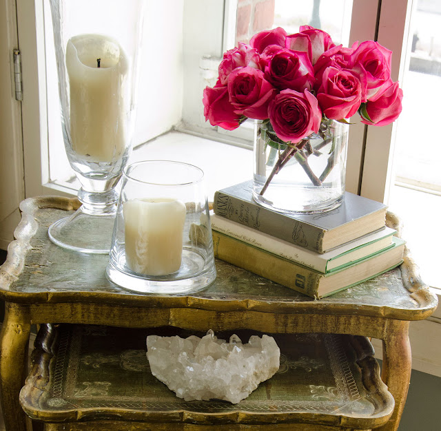 candles flowers books and interior decorating