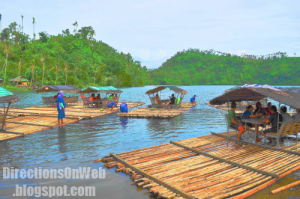 a bamboo raft is leaving from the bank of Lake Pandin