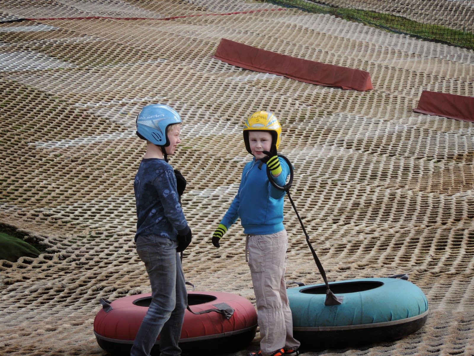 dry ski slope with inflatable inner tubes