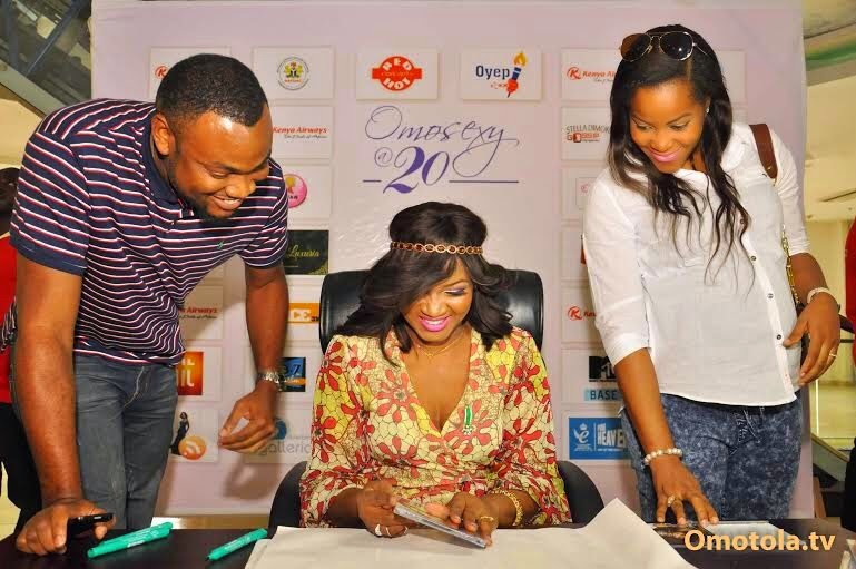 omotola autograph signing abuja