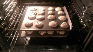 chocolate chip cookies baking in oven