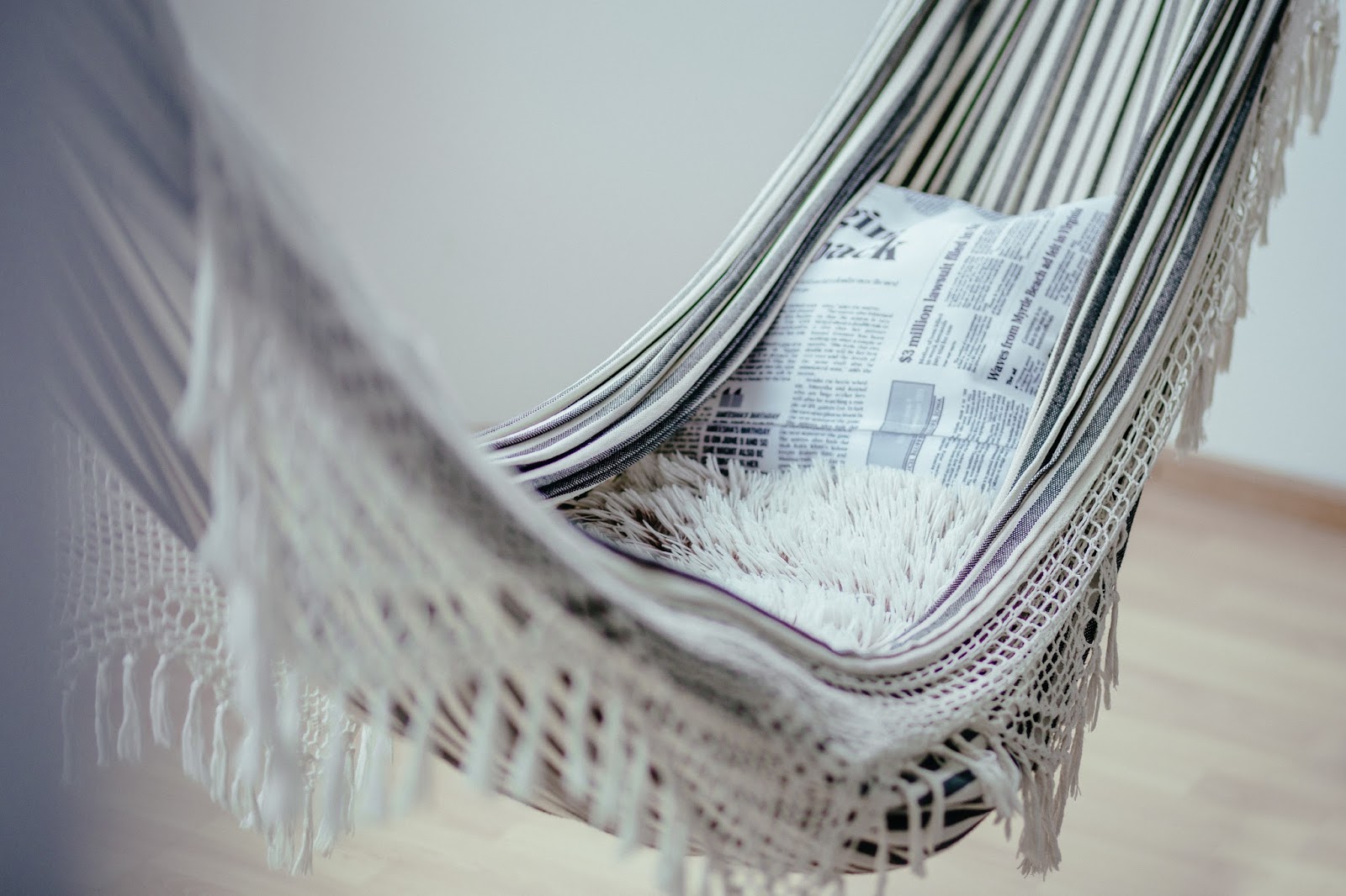 freshen up your living space for summer - hammock with a cushion in a living space