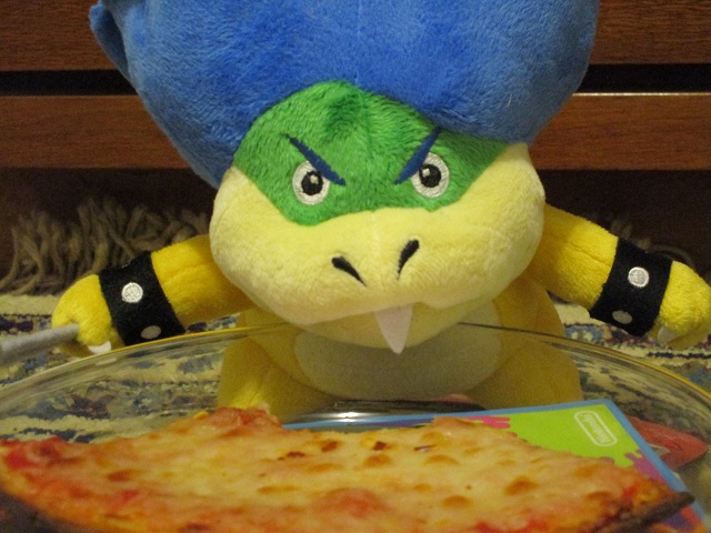 Ludwig Von Koopa plushie eaten pizza slice plate