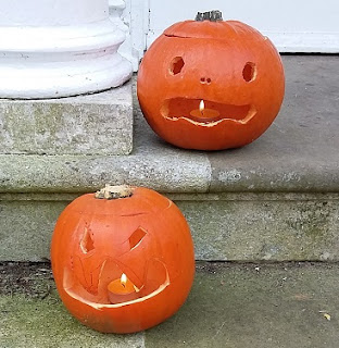 Picture of two Halloween pumpkins on our doorstep
