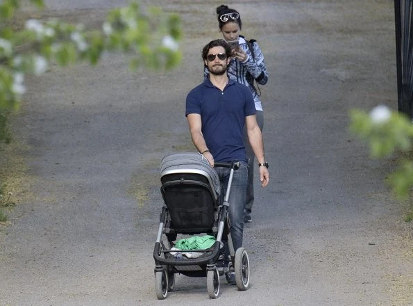 Prince Carl Philip, Princess Sofia and Prince Alexander were photographed while they were walking around Villa Solbacken (literally Villa Sunny Hill) in Djurgården