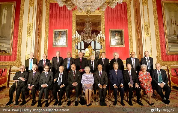 Queen Elizabeth II with members of the Order of Merit Professor Sir Michael Howard, Lord May of Oxford, Professor Sir Roger Penrose, Sir Michael Atiyah, the Duke of Edinburgh, Queen Elizabeth II, Lord Foster of Thames Bank, Sir Tom Stoppard, Lord Rothschild, Baroness Boothroyd, Sir David Attenborough, Dr Martin West, the Honourable John Howard, the Right Honourable John Chretien, Sir Tim Berners-Lee, Lord Eames, Lord Rees of Ludlow, Mr Neil MacGregor, Sir Simon Rattle, Sir Magdi Yacoub, and the Lord Fellowes at Windsor Castle