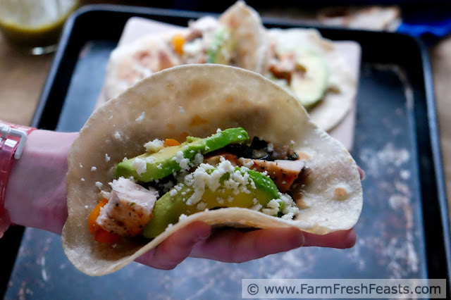 Flakes of seasoned fish set against sautéed bok choy and peppers in a warm tortilla, topped with avocado slices and crumbled queso. Use the farm share in unexpected ways with these tacos.