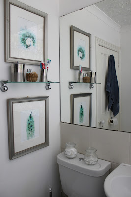 Adding two peacock prints to the bathroom