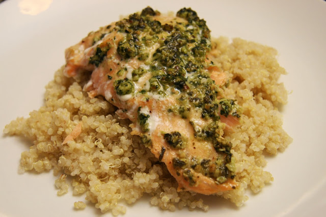 salmon topped with pesto on a bed of quinoa. 