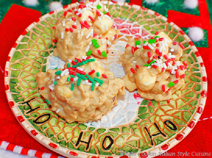 these are how to make a white chocolate and peanut butter krispie treat with marshmallows. They are on a Holiday Christmas plate with a Santa face on it. The candy style cookies has festive red and green sprinkles on top