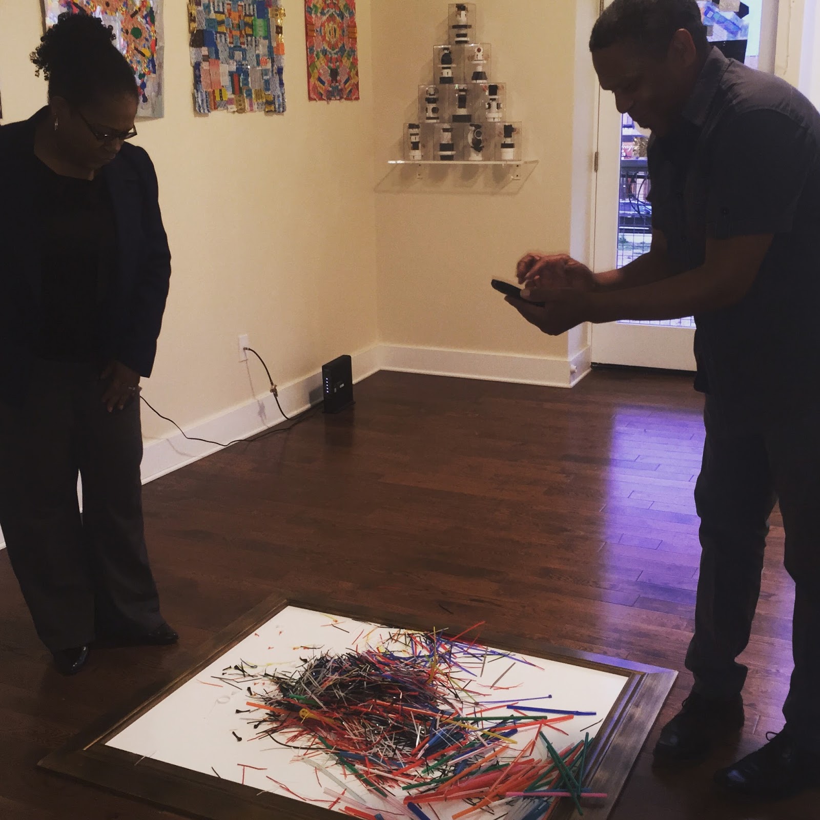 Alan Emerson Hicks taking a photo of Cascade artwork created by