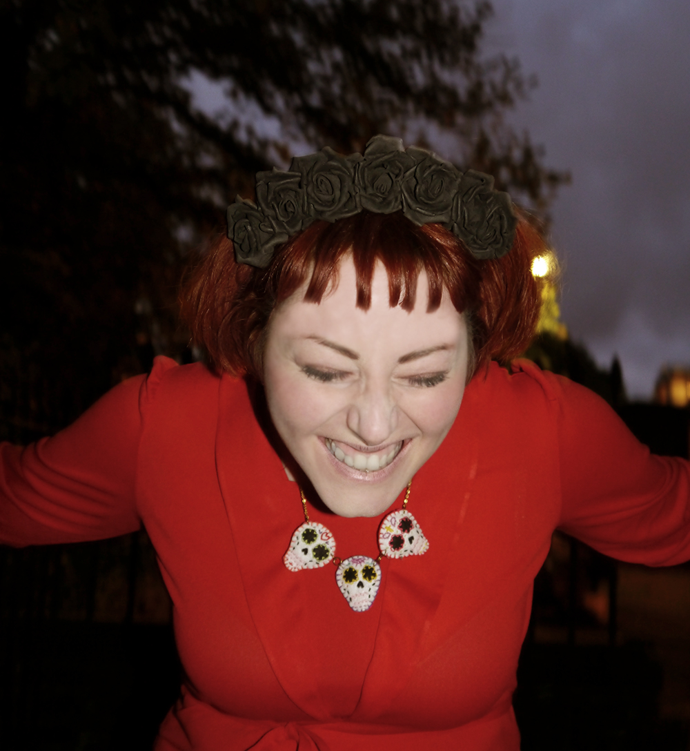 Halloween costume insired by Lydia Deetz unlikely horror icon, unlikely style icon, Lydia Deetz from Beetlejuice, Halloween costume inspiration, easy Halloween costume, Halloween costume ideas, Beetlejuice costume, red dress costume, red vintag dress, Kitsch Kitty sugar skull necklace, Irregular Choice zig zag heels, Crown & Glory black flower crown, Wardrobe Conversations, Scottish Blogger, Edinburgh graveyard, Halloween inspiration, horror inspiration, Time Burton style outfit