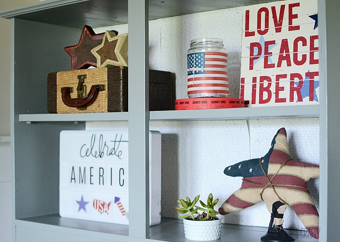 patriotic home decorations in gray cabinet for living room- light box, vintage suitcase, 4th of july decor