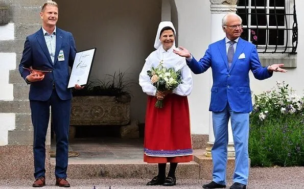 Solliden Palace in Öland. Queen Silvia is wearing a traditional local costume of Oland