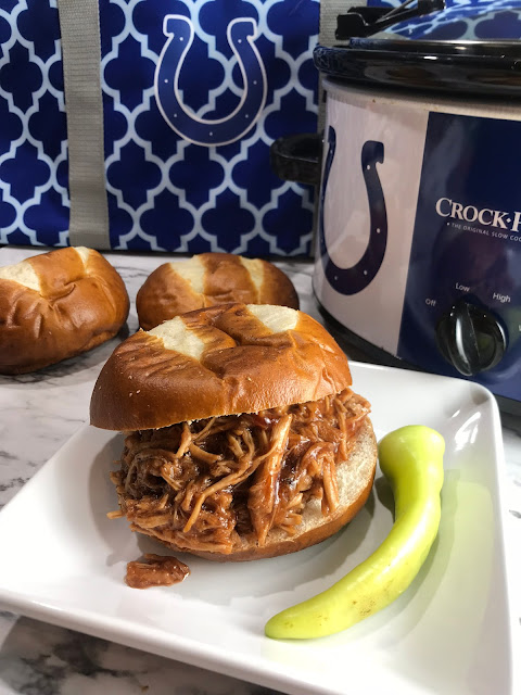 Making pulled pork in the crock pot is a simple meal.   Crock Pot Pulled Pork BBQ is a crowd favorite recipe to plan in advance for harvest, or bring to the game!  Chasing Saturdays.