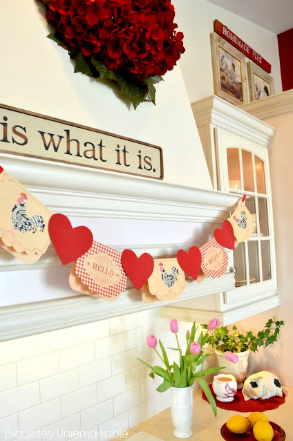 Chicken note card and red paper heart banner on kitchen hood