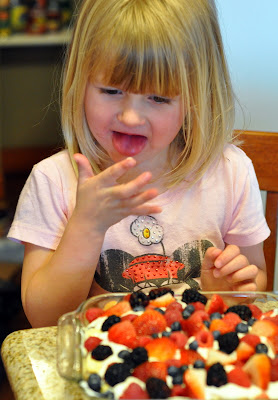 Girl eating berry trifle