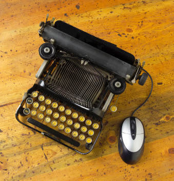 old fashioned typewriter with a modern mouse