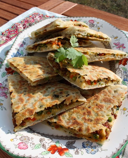 Food Lust People Love: Keema Naan - spicy lamb cooked with peas and carrots stuffed into soft dough and cooked in a non-stick pan - makes a wonderful starter or can even star in a meal rounded out by a crunchy side salad or cucumber raita.