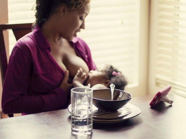 Mother breastfeeding kid