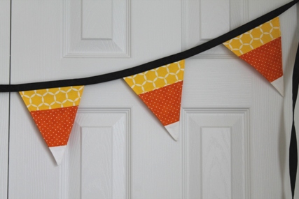candy corn colored triangle shaped bunting made with quilters cotton
