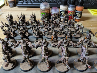 More progress! All the poxwalkers and the paints used for hour 9